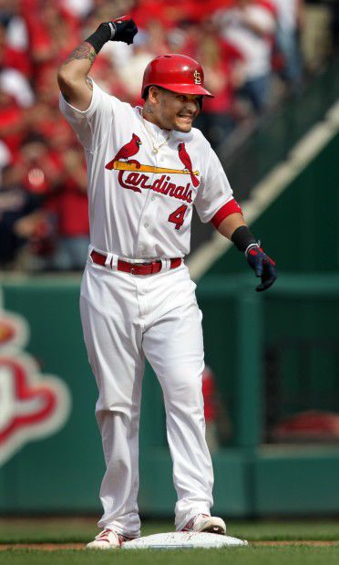 Molina celebrates a hit in Cardinals home opener